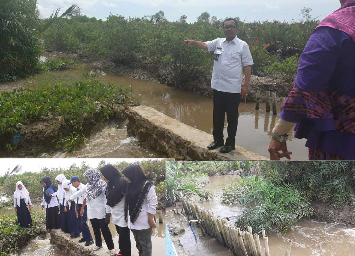 Atasi Banjir, Plt Kadisdik Batubara Gerak Cepat Tutup Aliran Air Dengan Goni Berisi Pasir