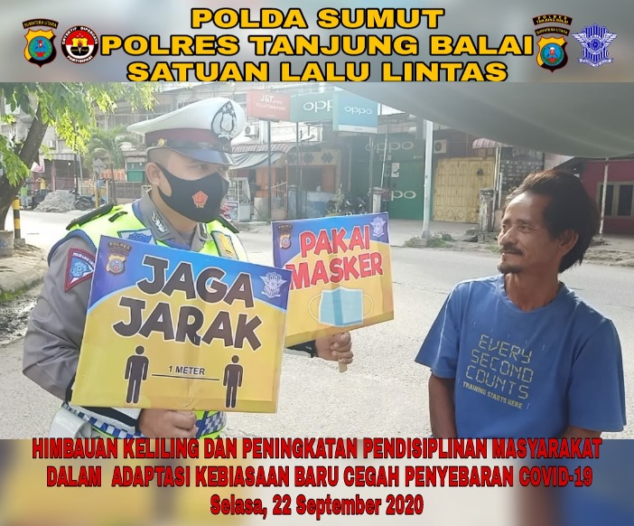 Polres Tanjung Balai Himbau Warga Tingkatkan Disiplin Prokes Covid-19 dan Berbagi Masker Geratis