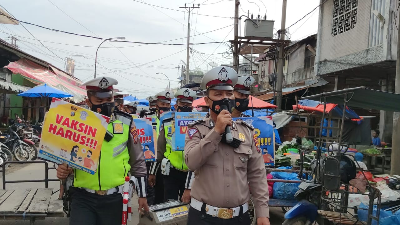 Himbau Prokes Covid-19, Sat Lantas Polres Tanjung Balai Laksanakan Vaksin
