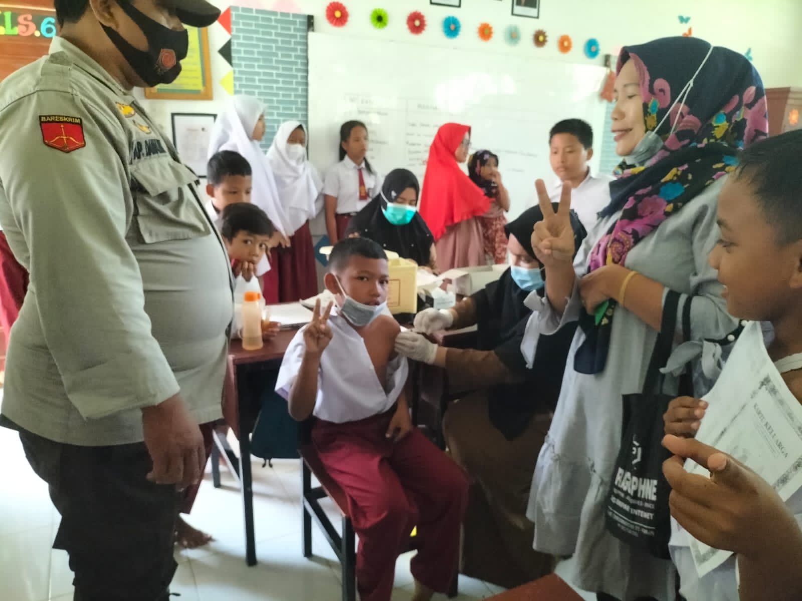 Polsek BP Mandoge Polres Asahan Vaksinasi 206 Orang Murid Dosis II di 2 Lokasi Sekolah Dasar