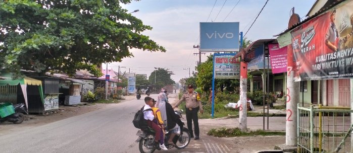 Pengamanan dan Pengaturan Arus Lalin, Personel Polsek Bandar Pulau Cegah Kecelakaan Lalu Lintas